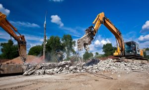 Using Excavators with Wrecking Balls: Effective Demolition Strategies